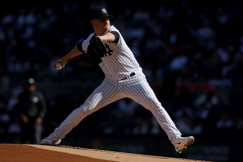 Apr 1, 2023; Bronx, New York, USA; New York Yankees starting pitcher Clarke Schmidt (36) pitches against the San Francisco Giants during the first inning at Yankee Stadium. Mandatory Credit: Brad Penner-USA TODAY Sports