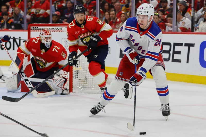 May 26, 2024; Sunrise, Florida, USA; New York Rangers right wing Kaapo Kakko (24) moves the puck against the Florida Panthers during the second period in game three of the Eastern Conference Final of the 2024 Stanley Cup Playoffs at Amerant Bank Arena. Mandatory Credit: Sam Navarro-USA TODAY Sports