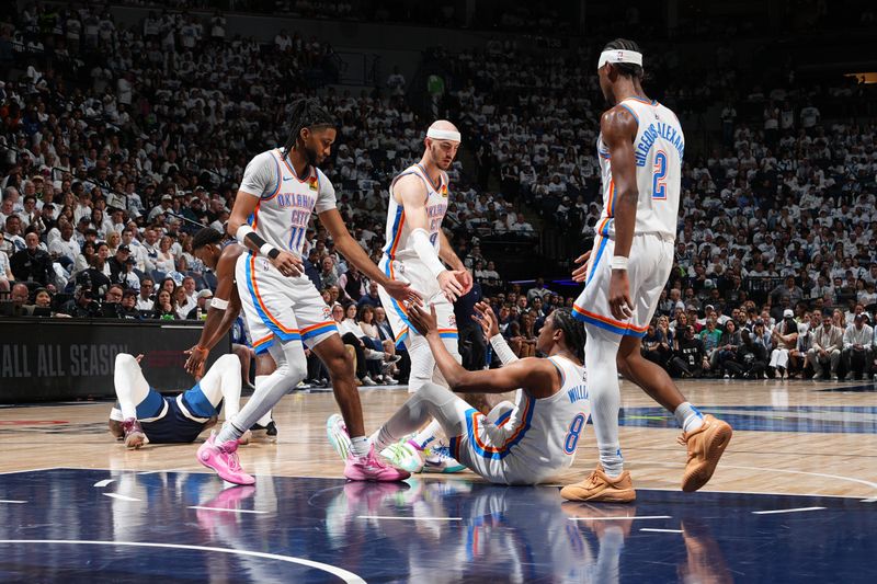 MINNEAPOLIS, MN -  MAY 24: Isaiah Joe #11 and Alex Caruso #9 help up Jalen Williams #8 of the Oklahoma City Thunder during the game against the Minnesota Timberwolves during Game 3 of the 2025 NBA Western Conference Finals on May 24, 2025 at Target Center in Minneapolis, Minnesota. NOTE TO USER: User expressly acknowledges and agrees that, by downloading and or using this Photograph, user is consenting to the terms and conditions of the Getty Images License Agreement. Mandatory Copyright Notice: Copyright 2025 NBAE (Photo by Jesse D. Garrabrant/NBAE via Getty Images)