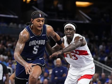 ORLANDO, FLORIDA - NOVEMBER 21: Paolo Banchero #5 of the Orlando Magic drives past Pascal Siakam #43 of the Toronto Raptors during the first half of an NBA In-Season Tournament game at Amway Center on November 21, 2023 in Orlando, Florida. NOTE TO USER: User expressly acknowledges and agrees that, by downloading and or using this photograph, User is consenting to the terms and conditions of the Getty Images License Agreement. (Photo by Rich Storry/Getty Images)