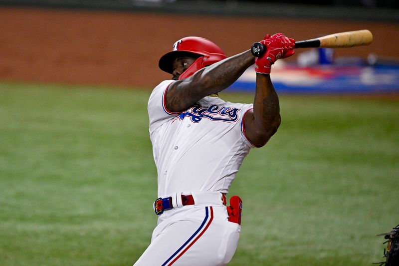 May 16, 2023; Arlington, Texas, USA; Texas Rangers right fielder Adolis Garcia (53) hits a single against the Atlanta Braves during the sixth inning at Globe Life Field. Mandatory Credit: Jerome Miron-USA TODAY Sports