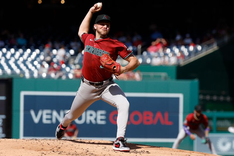 Jun 19, 2024; Washington, District of Columbia, USA; Arizona Diamondbacks starting pitcher Brandon Pfaadt (32) pitches against the Washington Nationals during the first inning at Nationals Park. Mandatory Credit: Geoff Burke-USA TODAY Sports