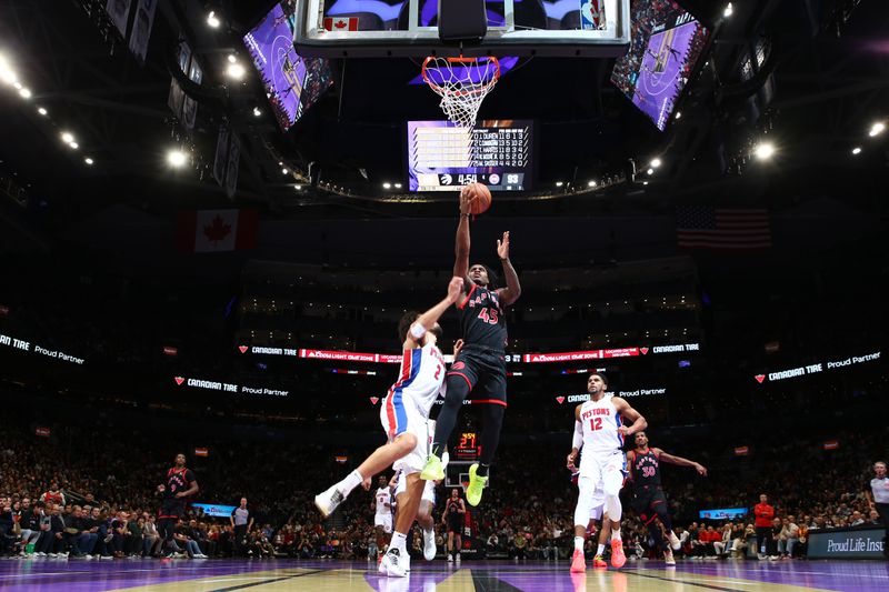 TORONTO, CANADA - NOVEMBER 15: Davion Mitchell #45 of the Toronto Raptors drives to the basket during the game against the Detroit Pistons during the Emirates NBA Cup game on November 15, 2024 at the Scotiabank Arena in Toronto, Ontario, Canada.  NOTE TO USER: User expressly acknowledges and agrees that, by downloading and or using this Photograph, user is consenting to the terms and conditions of the Getty Images License Agreement.  Mandatory Copyright Notice: Copyright 2024 NBAE (Photo by Vaughn Ridley/NBAE via Getty Images)