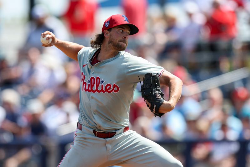 Mar 7, 2024; Port Charlotte, Florida, USA;  Philadelphia Phillies starting pitcher Aaron Nola (27) throws a pitch against the Tampa Bay Rays in the first inning at Charlotte Sports Park. Mandatory Credit: Nathan Ray Seebeck-USA TODAY Sports