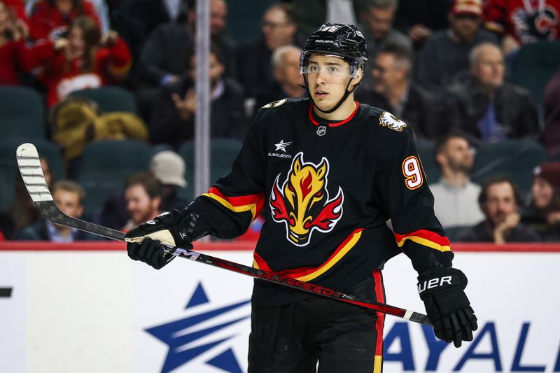 Nov 19, 2024; Calgary, Alberta, CAN; Calgary Flames left wing Andrei Kuzmenko (96) during the third period against the New York Islanders at Scotiabank Saddledome. Mandatory Credit: Sergei Belski-Imagn Images