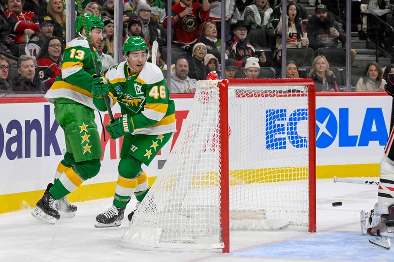 Nov 29, 2024; Saint Paul, Minnesota, USA;  Minnesota Wild defenseman Jared Spurgeon (46) banks the puck off of Chicago Blackhawks goalie Petr Mrazek (34) for a goal during the second period at Xcel Energy Center. Mandatory Credit: Nick Wosika-Imagn Images