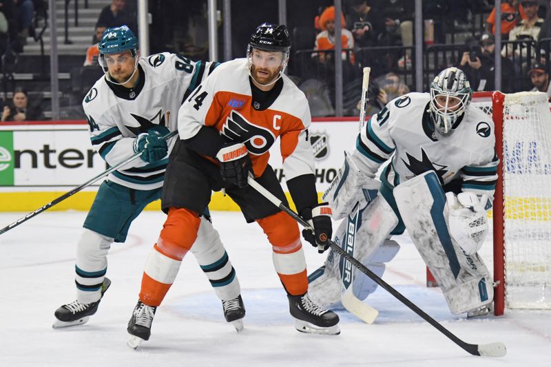 Nov 11, 2024; Philadelphia, Pennsylvania, USA; San Jose Sharks defenseman Jan Rutta (84) and goaltender Vitek Vanecek (41) battle for position with Philadelphia Flyers center Sean Couturier (14) during the first period at Wells Fargo Center. Mandatory Credit: Eric Hartline-Imagn Images