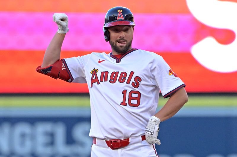 Jul 30, 2024; Anaheim, California, USA;  Los Angeles Angels first baseman Nolan Schanuel (18) flexes on second after a double in the first inning against the Colorado Rockies at Angel Stadium. Mandatory Credit: Jayne Kamin-Oncea-USA TODAY Sports