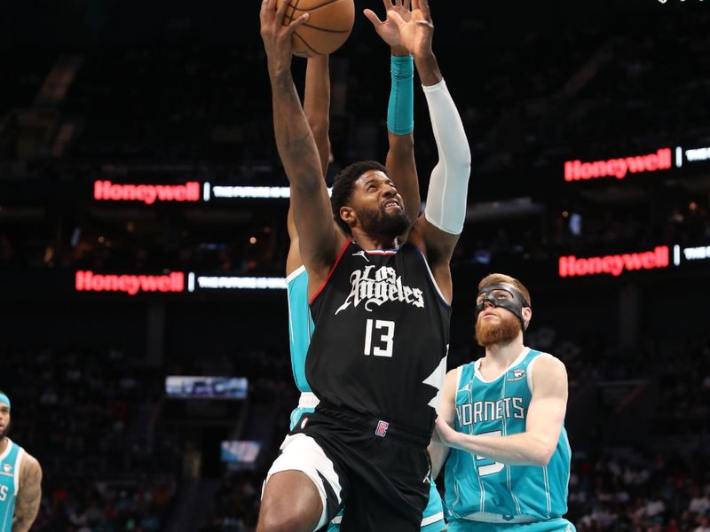 CHARLOTTE, NC - MARCH 31: Paul George #13 of the LA Clippers drives to the basket during the game against the Charlotte Hornets on March 31, 2024 at Spectrum Center in Charlotte, North Carolina. NOTE TO USER: User expressly acknowledges and agrees that, by downloading and or using this photograph, User is consenting to the terms and conditions of the Getty Images License Agreement.  Mandatory Copyright Notice:  Copyright 2024 NBAE (Photo by Brock Williams-Smith/NBAE via Getty Images)