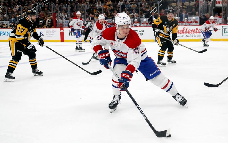 Jan 27, 2024; Pittsburgh, Pennsylvania, USA;  Montreal Canadiens left wing Juraj Slafkovsky (20) handles the puck against the Pittsburgh Penguins during the second period at PPG Paints Arena. Mandatory Credit: Charles LeClaire-USA TODAY Sports