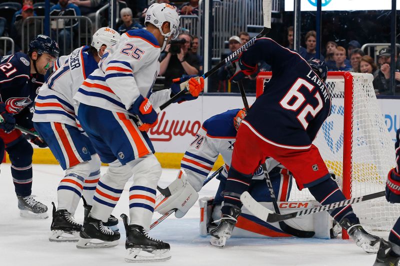 Oct 28, 2024; Columbus, Ohio, USA; Columbus Blue Jackets right wing Kevin Labanc (62) looks for a rebound of a Edmonton Oilers goalie Stuart Skinner (74) save during the second period at Nationwide Arena. Mandatory Credit: Russell LaBounty-Imagn Images