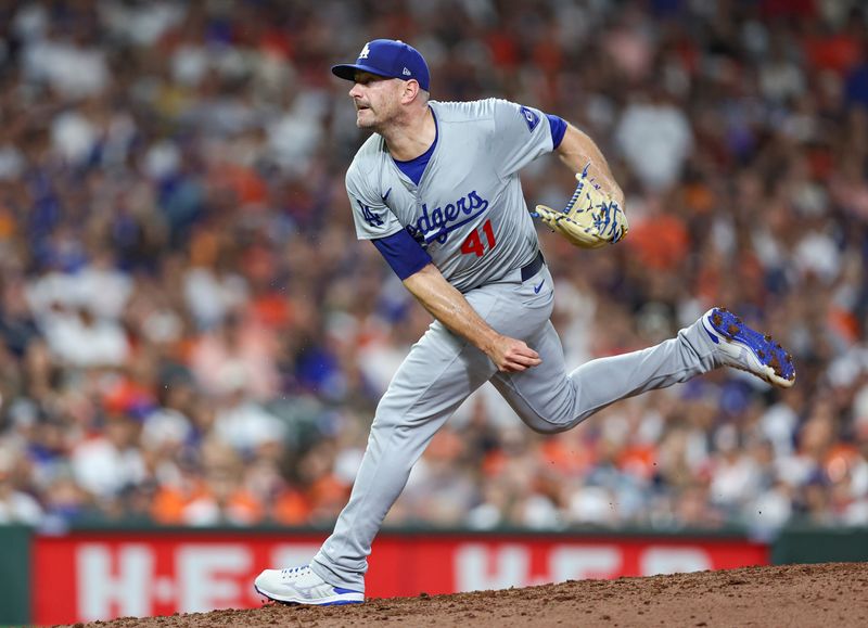 Jul 27, 2024; Houston, Texas, USA; Los Angeles Dodgers relief pitcher Daniel Hudson (41) delivers a pitch during the eighth inning against the Houston Astros at Minute Maid Park. Mandatory Credit: Troy Taormina-USA TODAY Sports