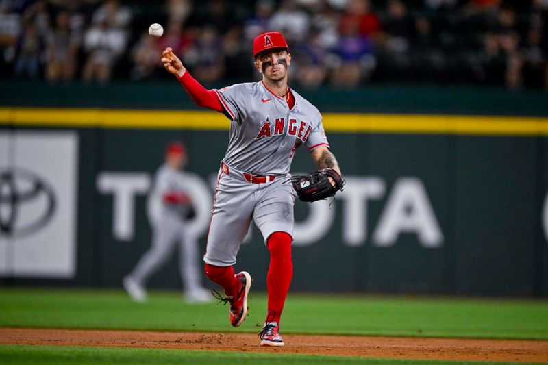 Sep 5, 2024; Arlington, Texas, USA; Los Angeles Angels shortstop Zach Neto (9) overthrows first base while trying to put out Texas Rangers center fielder Leody Taveras (not pictured) during the second inning at Globe Life Field. Mandatory Credit: Jerome Miron-Imagn Images