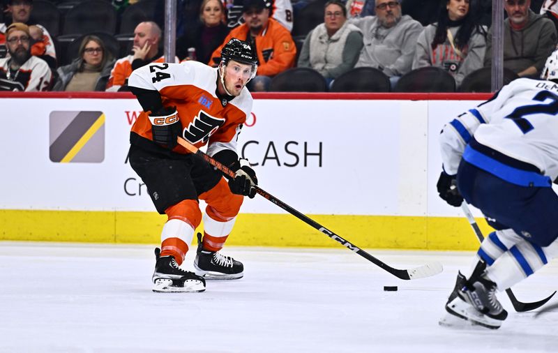 Feb 8, 2024; Philadelphia, Pennsylvania, USA; Philadelphia Flyers defenseman Nick Seeler (24) controls the puck against the Winnipeg Jets in the third period at Wells Fargo Center. Mandatory Credit: Kyle Ross-USA TODAY Sports