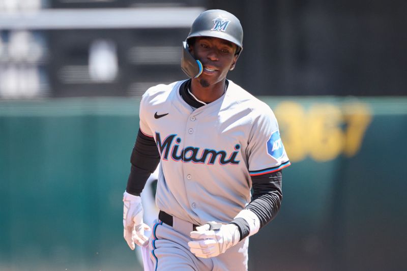 May 5, 2024; Oakland, California, USA; Miami Marlins outfielder Nick Gordon (1) runs the bases after hitting a three run home run against the Oakland Athletics during the first inning at Oakland-Alameda County Coliseum. Mandatory Credit: Robert Edwards-USA TODAY Sports