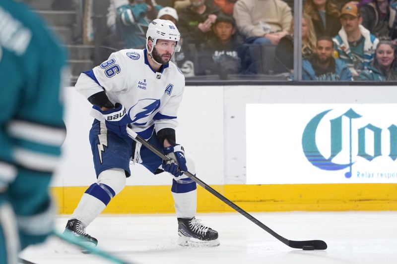 Jan 3, 2026; San Jose, California, USA; Tampa Bay Lightning right wing Nikita Kucherov (86) skates with the puck against the San Jose Sharks during the third period at SAP Center at San Jose. Mandatory Credit: Darren Yamashita-Imagn Images