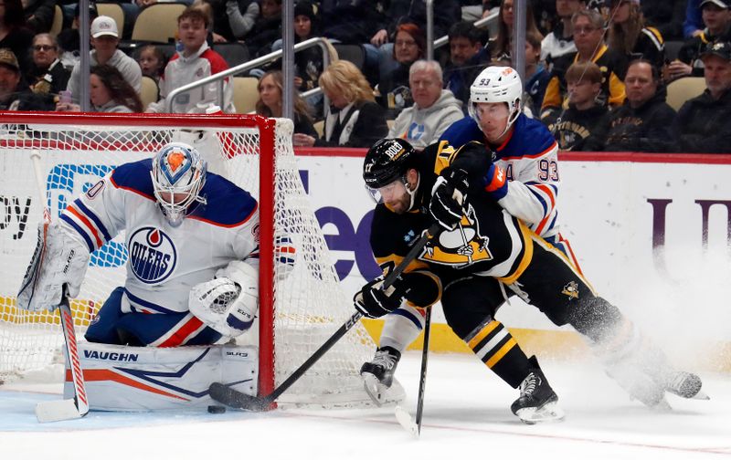 Mar 10, 2024; Pittsburgh, Pennsylvania, USA;  Edmonton Oilers goaltender Calvin Pickard (30) makes a save on a wrap around attempt by Pittsburgh Penguins right wing Bryan Rust (17) as Oilers center Ryan Nugent-Hopkins (93) defends during the first period at PPG Paints Arena. Mandatory Credit: Charles LeClaire-USA TODAY Sports