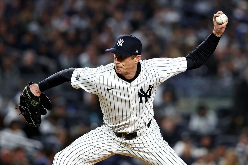 Oct 15, 2024; Bronx, New York, USA; New York Yankees pitcher Tim Hill (54) pitches during the fifth inning against the Cleveland Guardians in game two of the ALCS for the 2024 MLB Playoffs at Yankee Stadium. Mandatory Credit: Wendell Cruz-Imagn Images