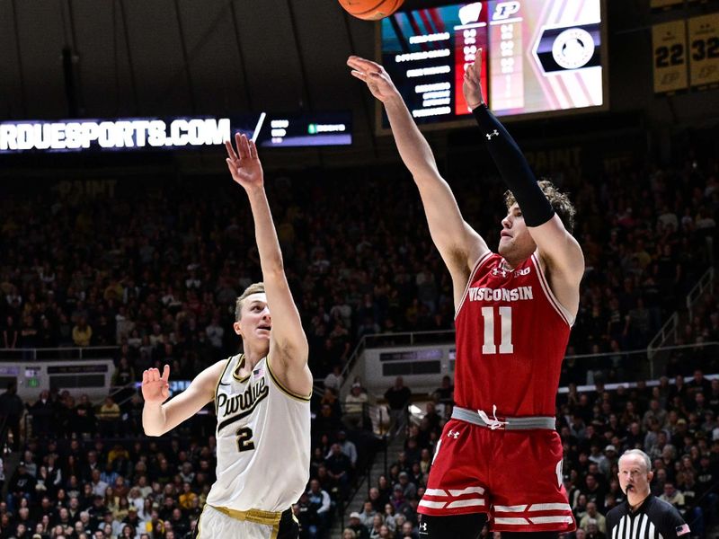 Mar 10, 2024; West Lafayette, Indiana, USA; Wisconsin Badgers guard Max Klesmit (11) shoots the ball in front of Purdue Boilermakers guard Fletcher Loyer (2) during the first half at Mackey Arena. Mandatory Credit: Marc Lebryk-USA TODAY Sports