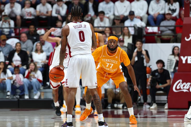 Jan 24, 2026; Tuscaloosa, Alabama, USA; Tennessee Volunteers guard Amaree Abram (77) guards Alabama Crimson Tide guard Labaron Philon (0) during the first half at Coleman Coliseum. Mandatory Credit: David Leong-Imagn Images