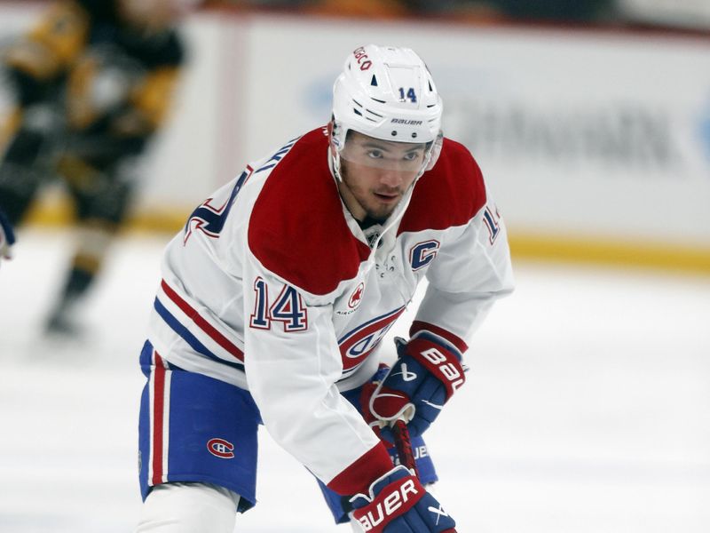 Nov 2, 2024; Pittsburgh, Pennsylvania, USA;  Montreal Canadiens center Nick Suzuki (14) warms up against the Pittsburgh Penguins at PPG Paints Arena. Mandatory Credit: Charles LeClaire-Imagn Images