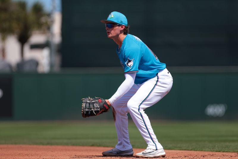 Mar 10, 2026; Jupiter, Florida, USA; Miami Marlins first baseman Griffin Conine (18) defends his position against the Washington Nationals during the fourth inning at Roger Dean Chevrolet Stadium. Mandatory Credit: Sam Navarro-Imagn Images