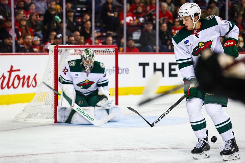 Dec 4, 2025; Calgary, Alberta, CAN; Minnesota Wild defenseman Brock Faber (7) blocks the shot against the Calgary Flames during the second period at Scotiabank Saddledome. Mandatory Credit: Sergei Belski-Imagn Images