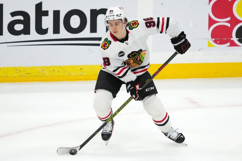 Nov 12, 2023; Sunrise, Florida, USA; Chicago Blackhawks center Connor Bedard (98) skates with the puck against the Florida Panthers during the third period at Amerant Bank Arena. Mandatory Credit: Jasen Vinlove-USA TODAY Sports