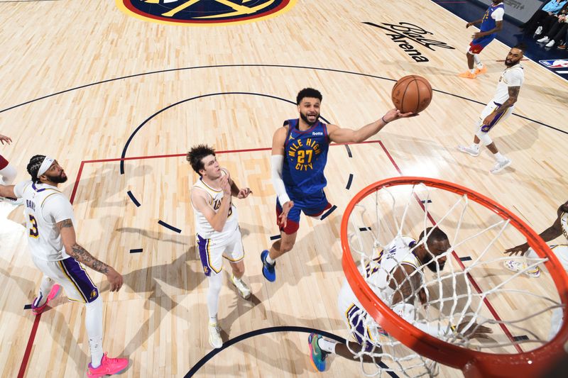 DENVER, CO - APRIL 20: Jamal Murray #27 of the Denver Nuggets drives to the basket during the game against the Los Angeles Lakers during Round 1 Game 1 of the 2024 NBA Playoffs on April 20, 2024 at the Ball Arena in Denver, Colorado. NOTE TO USER: User expressly acknowledges and agrees that, by downloading and/or using this Photograph, user is consenting to the terms and conditions of the Getty Images License Agreement. Mandatory Copyright Notice: Copyright 2024 NBAE (Photo by Garrett Ellwood/NBAE via Getty Images)