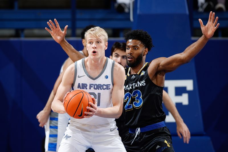 Mar 4, 2023; Colorado Springs, Colorado, USA; Air Force Falcons forward Rytis Petraitis (31) controls the ball ahead of San Jose State Spartans forward Sage Tolbert III (23) in the first half at Clune Arena. Mandatory Credit: Isaiah J. Downing-USA TODAY Sports