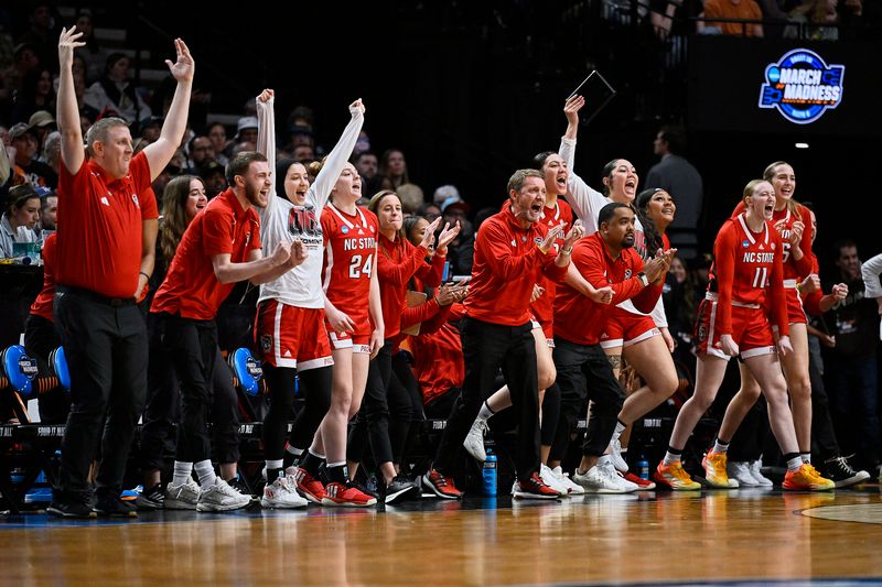 Mar 29, 2024; Portland, OR, USA; The NC State Wolfpack celebrate after a game against the Stanford Cardinal in the semifinals of the Portland Regional of the 2024 NCAA Tournament at the Moda Center at the Moda Center. Mandatory Credit: Troy Wayrynen-USA TODAY Sports