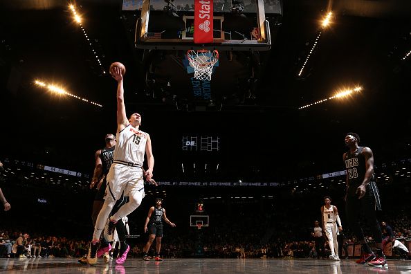 BROOKLYN, NY - DECEMBER 22: Nikola Jokic #15 of the Denver Nuggets goes to the basket during the game on December 22, 2023 at Barclays Center in Brooklyn, New York. NOTE TO USER: User expressly acknowledges and agrees that, by downloading and or using this Photograph, user is consenting to the terms and conditions of the Getty Images License Agreement. Mandatory Copyright Notice: Copyright 2023 NBAE (Photo by Nathaniel S. Butler/NBAE via Getty Images)