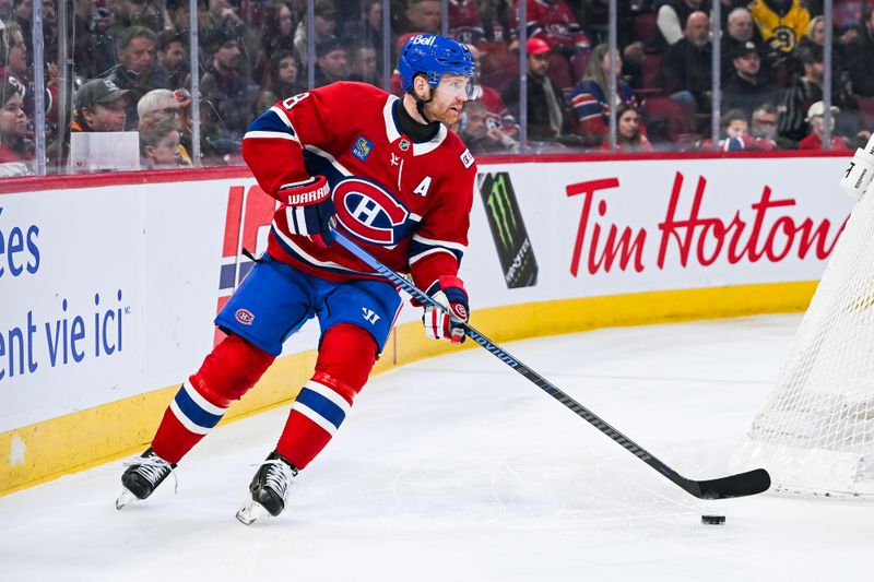 Mar 17, 2026; Montreal, Quebec, CAN; Montreal Canadiens defenseman Mike Matheson (8) plays the puck against the Boston Bruins during the first period at Bell Centre. Mandatory Credit: David Kirouac-Imagn Images