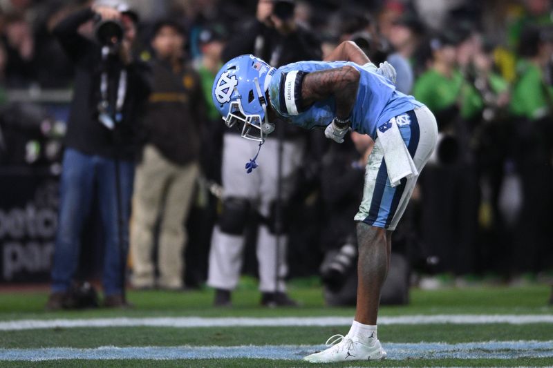 Dec 28, 2022; San Diego, CA, USA; North Carolina Tar Heels wide receiver Kobe Paysour (8) celebrates after scoring a touchdown against the Oregon Ducks during the second quarter of the 2022 Holiday Bowl at Petco Park. Mandatory Credit: Orlando Ramirez-USA TODAY Sports