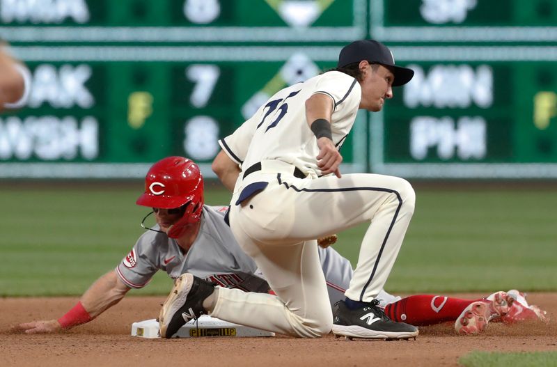 Aug 13, 2023; Pittsburgh, PA, USA; Cincinnati Reds second baseman Matt McLain (rear) is tagged out by Pittsburgh Pirates shortstop Alika Williams (75) on a steal attempt of second base during the seventh inning at PNC Park. Mandatory Credit: Charles LeClaire-USA TODAY Sports