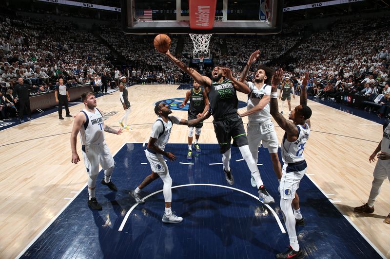 MINNEAPOLIS, MN - MAY 30: Karl-Anthony Towns #32 of the Minnesota Timberwolves drives to the basket during the game against the Dallas Mavericks during Game 5 of the Western Conference Finals during the 2024 NBA Playoffs on May 30, 2024 at Target Center in Minneapolis, Minnesota. NOTE TO USER: User expressly acknowledges and agrees that, by downloading and or using this Photograph, user is consenting to the terms and conditions of the Getty Images License Agreement. Mandatory Copyright Notice: Copyright 2024 NBAE (Photo by David Sherman/NBAE via Getty Images)