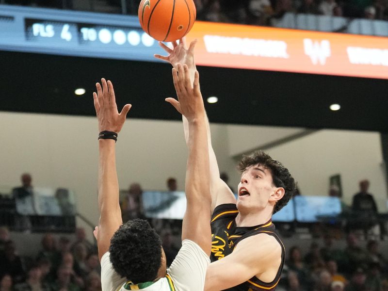 Feb 21, 2026; Waco, Texas, USA; Arizona State Sun Devils forward Santiago Trouet (1) shoots as Baylor Bears center Caden Powell (44) defends during the first half at Paul and Alejandra Foster Pavilion. Mandatory Credit: Chris Jones-Imagn Images