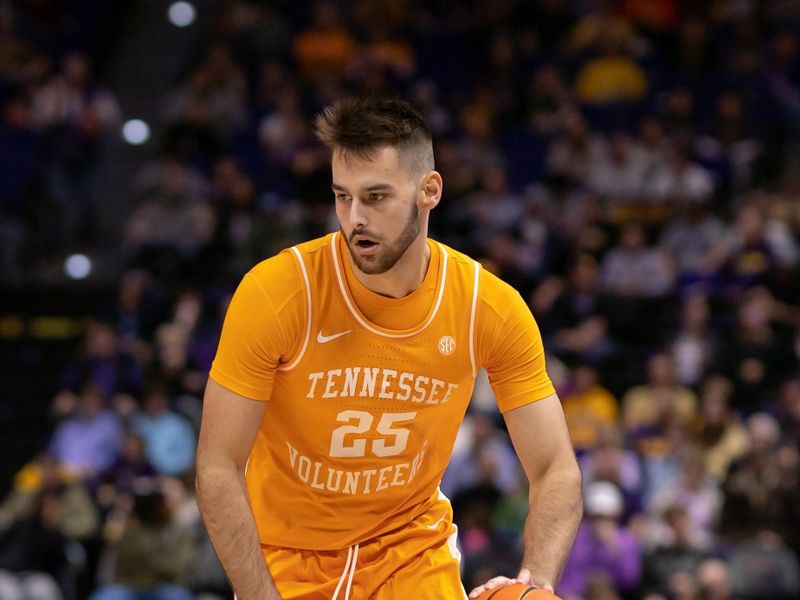 Jan 21, 2023; Baton Rouge, Louisiana, USA;  Tennessee Volunteers guard Santiago Vescovi (25) brings the ball up court against the LSU Tigers during the second half at Pete Maravich Assembly Center. Mandatory Credit: Stephen Lew-USA TODAY Sports