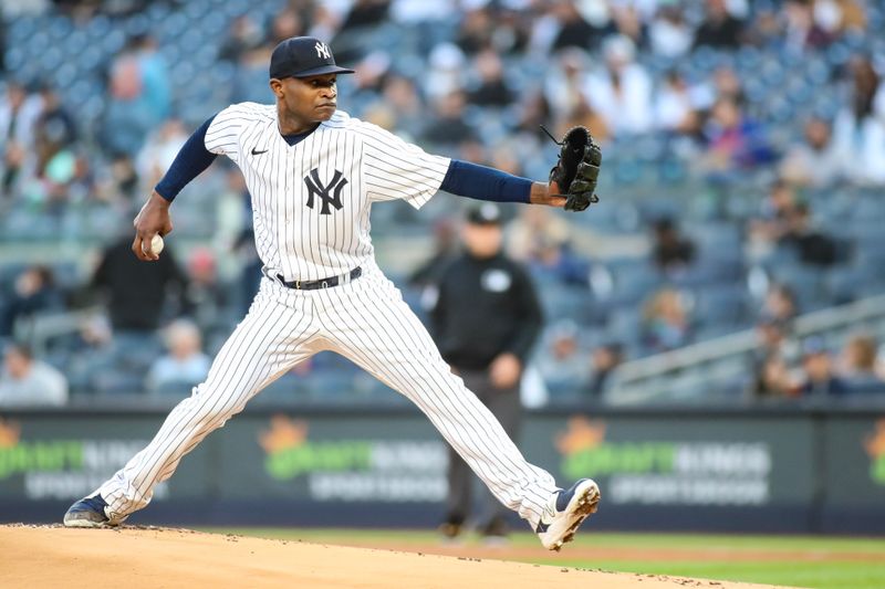 May 1, 2023; Bronx, New York, USA;  New York Yankees starting pitcher Domingo German (0) pitches in the first inning against the Cleveland Guardians at Yankee Stadium. Mandatory Credit: Wendell Cruz-USA TODAY Sports