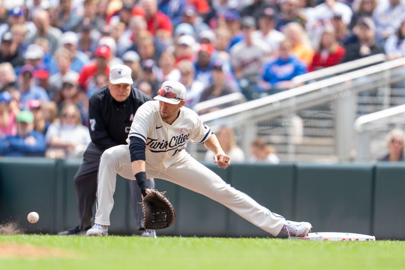 May 14, 2023; Minneapolis, Minnesota, USA; Minnesota Twins left fielder Alex Kirilloff (19) catches the throw retiring Chicago Cubs third baseman Patrick Wisdom (16) in the seventh inning at Target Field. Mandatory Credit: Matt Blewett-USA TODAY Sports