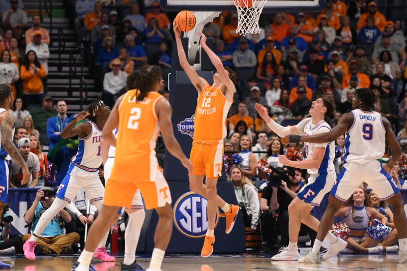 Mar 16, 2025; Nashville, TN, USA;Tennessee Volunteers forward Cade Phillips (12) shoots the ball against the Florida Gators in the first half during the 2025 SEC Championship Game at Bridgestone Arena. Mandatory Credit: Steve Roberts-Imagn Images