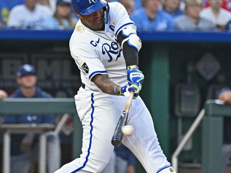 Jul 15, 2023; Kansas City, Missouri, USA;  Kansas City Royals designated hitter Salvador Perez (13) singles against the Tampa Bay Rays in the ninth inning at Kauffman Stadium. Mandatory Credit: Peter Aiken-USA TODAY Sports