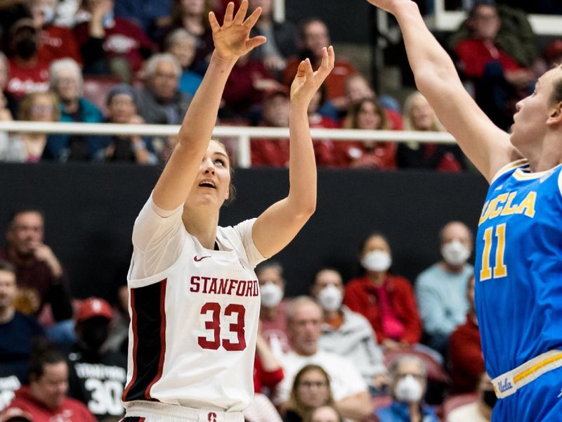 Feb 20, 2023; Stanford, California, USA;  Stanford Cardinal guard Hannah Jump (33) shoots over UCLA Bruins forward Emily Bessoir (11) during the first half at Maples Pavilion. Mandatory Credit: John Hefti-USA TODAY Sports