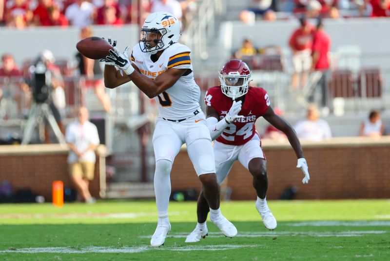 Sep 3, 2022; Norman, Oklahoma, USA;  UTEP Miners wide receiver Jeremiah Ballard (0) makes a catch in fron tof Oklahoma Sooners defensive back Gentry Williams (24) during the second half at Gaylord Family-Oklahoma Memorial Stadium. Mandatory Credit: Kevin Jairaj-USA TODAY Sports
