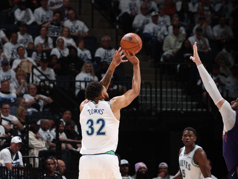 MINNEAPOLIS, MN -  APRIL 23: Karl-Anthony Towns #32 of the Minnesota Timberwolves shoots the ball during the game against the Phoenix Suns during Round 1 Game 2 of the 2024 NBA Playoffs on April 23, 2024 at Target Center in Minneapolis, Minnesota. NOTE TO USER: User expressly acknowledges and agrees that, by downloading and or using this Photograph, user is consenting to the terms and conditions of the Getty Images License Agreement. Mandatory Copyright Notice: Copyright 2024 NBAE (Photo by David Sherman/NBAE via Getty Images)