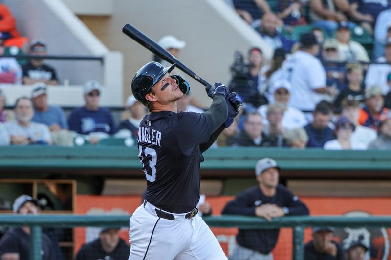 Mar 21, 2025; Lakeland, Florida, USA; Detroit Tigers catcher Dillon Dingler (13) hits a fly ball during the second inning against the New York Yankees at Publix Field at Joker Marchant Stadium. Mandatory Credit: Mike Watters-Imagn Images