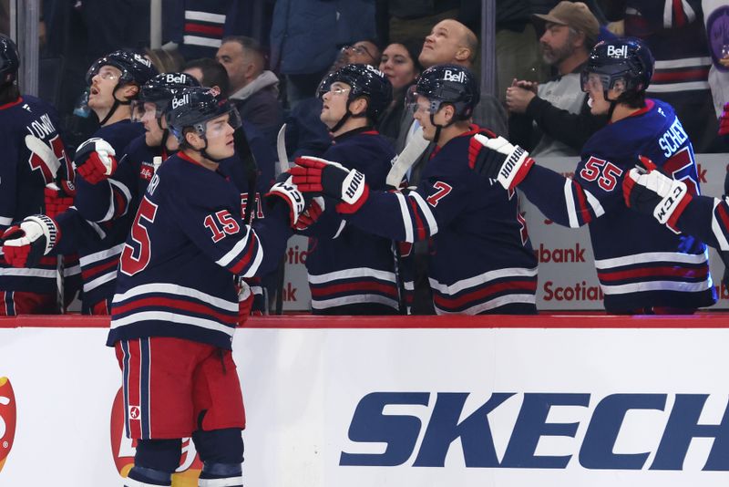 Nov 9, 2024; Winnipeg, Manitoba, CAN; Winnipeg Jets center Rasmus Kupari (15) celebrates his first period goal against the Dallas Stars at Canada Life Centre. Mandatory Credit: James Carey Lauder-Imagn Images