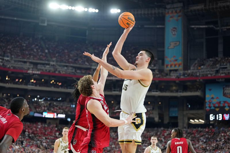 Apr 6, 2024; Glendale, AZ, USA; Purdue Boilermakers center Zach Edey (15) shoots the ball against North Carolina State Wolfpack forward Ben Middlebrooks (34) during the second half in the semifinals of the men's Final Four of the 2024 NCAA Tournament at State Farm Stadium. Mandatory Credit: Bob Donnan-USA TODAY Sports