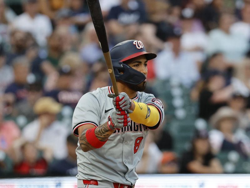 Jun 12, 2024; Detroit, Michigan, USA;  Washington Nationals right fielder Eddie Rosario (8) hits a RBI single in the fifth inning against the Detroit Tigers at Comerica Park. Mandatory Credit: Rick Osentoski-USA TODAY Sports
