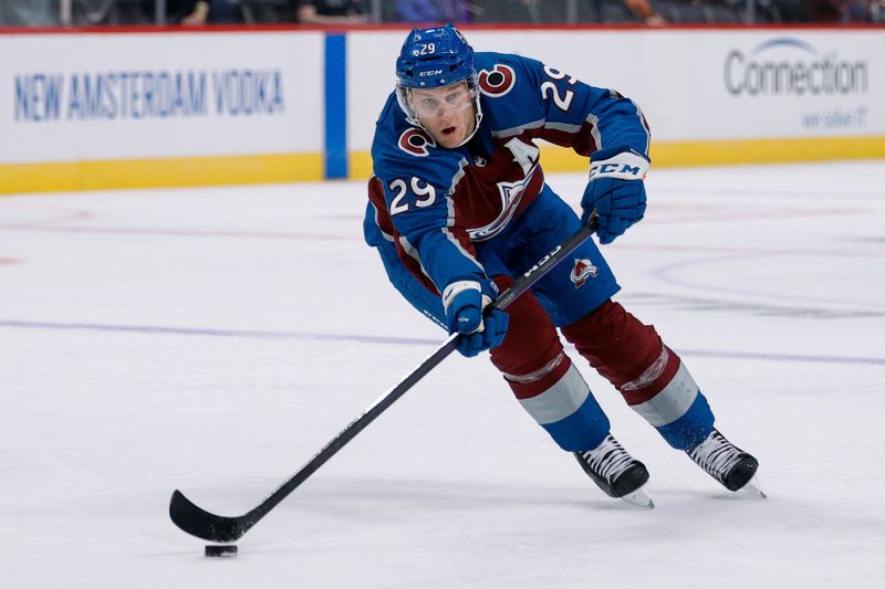 Oct 5, 2022; Denver, Colorado, USA; Colorado Avalanche center Nathan MacKinnon (29) controls the puck in the second period against the Dallas Stars at Ball Arena. Mandatory Credit: Isaiah J. Downing-USA TODAY Sports